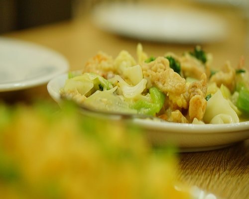 Fresh vegetables and ingredients on a kitchen table